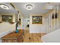 Elegant foyer featuring hardwood floors, decorative accents, and a staircase at 100 S Tremain St # G1, Mount Dora, FL 32757