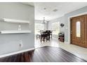 Cozy dining area featuring tile floors and natural light from the windows at 1108 Cedar St, Leesburg, FL 34748