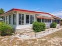 Well-maintained home with a tidy yard and walkway leading to the entrance at 1312 Apache Cir, Tavares, FL 32778