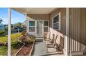 Inviting porch with seating area provides a cozy spot to enjoy the outdoors and relax at 1401 W Highway 50 # 43, Clermont, FL 34711