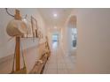 Inviting hallway featuring tile floors, neutral walls, and decor for a welcoming atmosphere at 3719 Holly Grove Ln, Mount Dora, FL 32757