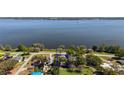 Aerial view of property highlighting its proximity to a large lake at 603 N Lakeshore Blvd, Howey In The Hills, FL 34737