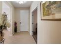 Bright foyer with tile flooring and neutral paint leads into a spacious home with lots of natural light at 906 Shady Canyon Way, Poinciana, FL 34759