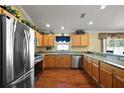 Bright kitchen featuring stainless steel appliances and granite countertops at 1625 Belle Grove Dr, The Villages, FL 32162