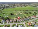 A high angle view of a home on the golf course in a scenic suburban neighborhood at 1726 Augustine Dr, The Villages, FL 32159