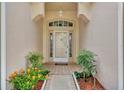 Inviting entryway with decorative brick flooring and a charming front door at 2205 Stonebridge Way, Clermont, FL 34711