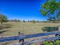 Expansive backyard view, showcasing the property's open space and the picturesque rural surroundings at 337 Olanta Dr, The Villages, FL 32162