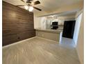 Bright kitchen featuring stainless steel appliances, light gray cabinets and ample counter space at 1000 Royal Oak Blvd, Leesburg, FL 34748