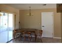 Dining room with four chairs and gold chandelier at 5221 Se 107Th Pl, Belleview, FL 34420