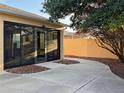 Enclosed patio with a peaceful garden view and concrete patio at 880 Radclife Berea Pl, The Villages, FL 32162