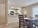 Open-concept kitchen with granite countertops and stainless appliances at 880 Radclife Berea Pl, The Villages, FL 32162