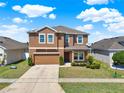 Charming home with a well-manicured lawn, tidy landscaping, and neutral-colored stucco at 2520 Tanner Ter, Kissimmee, FL 34743