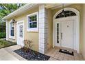 Home's entryway featuring a decorative front door with glass accents at 6152 Topsail Rd, Lady Lake, FL 32159