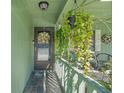 This property has a well lit front porch with hanging plants and room for furniture at 628 Mount Homer Rd # 4B, Eustis, FL 32726