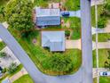 Aerial view of the home and outlining property lines at 701 Cottage Park Ln, Leesburg, FL 34748