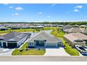 Well-maintained single Gathering home with a landscaped front yard and picturesque pond view at 7250 Trundle Ter, The Villages, FL 34762