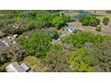 Sprawling property showcasing the home with a long driveway and pond views at 1107 Valley Rd, Fruitland Park, FL 34731