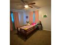 Cozy bedroom featuring a ceiling fan and bright, colorful decor at 15159 Sw 43Rd Terrace Rd, Ocala, FL 34473