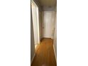 Hallway with hardwood flooring and white doors at 15159 Sw 43Rd Terrace Rd, Ocala, FL 34473