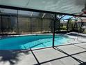 Enclosed swimming pool area with patio, offering a private and relaxing space at 2181 Gretna Dr, Deltona, FL 32738