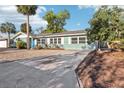 Exterior showcasing well-maintained landscaping and curb appeal at 219 N Rossiter St, Mount Dora, FL 32757