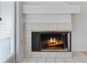 Cozy fireplace with decorative tile surround, perfect for a relaxing ambiance at 2210 Stonington Ave # 2210, Orlando, FL 32817