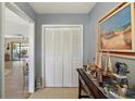 The entryway features a closet and nautical decor with tile flooring at 28416 Tammi Dr, Tavares, FL 32778