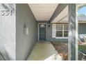 Inviting front entrance with a covered porch and stylish door at 331 W Lewis Ave, Apopka, FL 32712