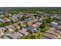 Aerial view of a home in a beautiful community with mature trees and well-maintained lawns at 3728 Mulberry Grove Loop, Leesburg, FL 34748