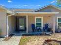 Inviting front porch with seating, providing a cozy outdoor space for relaxing and enjoying the neighborhood at 6679 Cr 613, Bushnell, FL 33513