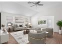 Bright living room featuring hardwood floors, neutral walls, modern decor, and plenty of natural light at 737 Caldwell Ct, The Villages, FL 32162