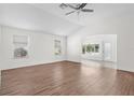 Bright living room featuring hardwood floors, neutral walls, and plenty of natural light at 737 Caldwell Ct, The Villages, FL 32162