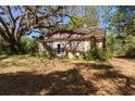 Exterior angle highlighting the vintage stone detail and architectural potential at 801 Kilgore St, Wildwood, FL 34785