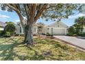 Charming single-story home with a well-manicured lawn and inviting two-car garage at 17089 Se 79Th Clearview Ave, The Villages, FL 32162