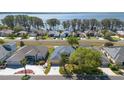 An aerial shot of the home showing the lake view and neighborhood at 2982 Lake Huron Ln, Tavares, FL 32778