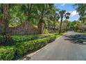 A view of the High Point community sign surrounded by lush greenery at 590 Sandlake Ct, Mount Dora, FL 32757