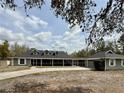 This home has a screened in porch, providing an ideal space for outdoor entertaining and relaxation at 42836 Royal Trails Rd, Eustis, FL 32736