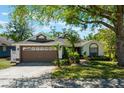 Charming single-story home with a well-manicured lawn and inviting curb appeal at 815 Thousand Oaks Blvd, Davenport, FL 33896