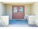 Elegant double front doors with decorative glass panels and a covered porch area, providing a stylish entrance at 1101 Saldivar Rd, The Villages, FL 32159