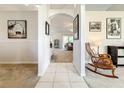 Bright hallway with tile flooring, archways, and a glimpse of the living room at 1407 Island Cove Dr, Deland, FL 32724