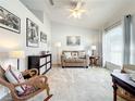 Comfortable living room with neutral carpet, vaulted ceiling, and lots of natural light at 1407 Island Cove Dr, Deland, FL 32724