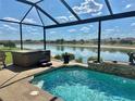 Enjoy the Florida sunshine from this screened lanai with beautiful pool and relaxing spa at 17066 Se 111Th Ter, Summerfield, FL 34491