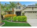Charming home with a two-car garage and a beautifully landscaped front yard at 20816 Sullivan Ranch Blvd, Mount Dora, FL 32757