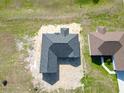Birds-eye view of the new home featuring a dark gray roof and lawn at 2581 Se 75Th Blvd, Bushnell, FL 33513