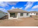 This home features an expansive backyard with a sliding glass door leading to the patio at 5511 Nickerbean St, Apopka, FL 32712