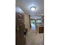 Tiled foyer leading into the spacious condo with sliding doors to the lanai at 8801 Worldquest Blvd # 4203, Orlando, FL 32821