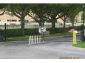 Elegant gated entrance to the community, featuring sturdy ironwork and lush landscaping at 1010 Chelsea Dr, Davenport, FL 33897