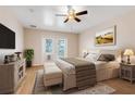 Comfortable bedroom with queen size bed and natural light at 10257 Dovehill Ln, Clermont, FL 34711