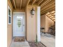 Inviting front door with stylish light fixture, cute doormat, and convenient bike storage nearby at 1051 S Highland St # 4B, Mount Dora, FL 32757