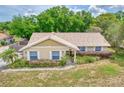 A bird's eye view of a well-maintained home with tidy landscaping and neutral color scheme at 11763 Oswalt Rd, Clermont, FL 34711